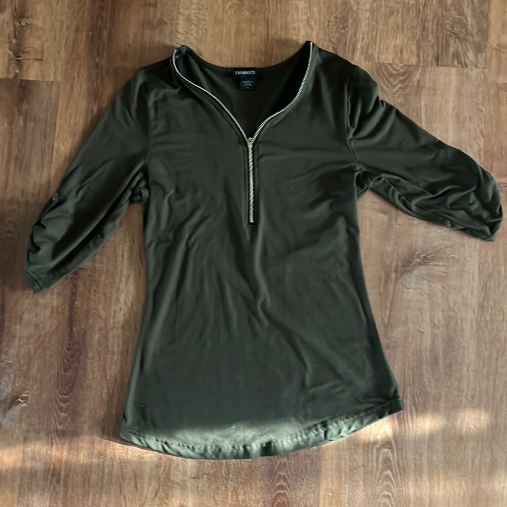 Olive green fitted blouse, zipper detailing in front, buttoned sleeves at bottom